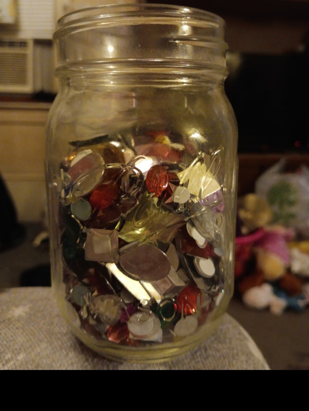 Mason jar filled with misc embellishments